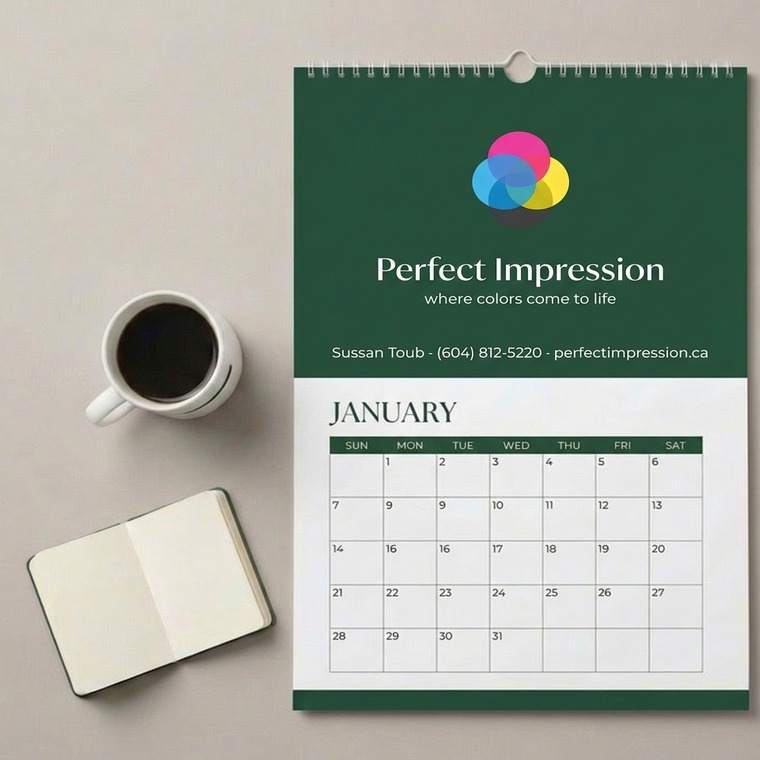 8.5x11 calendar photographed with coffee and a notebook