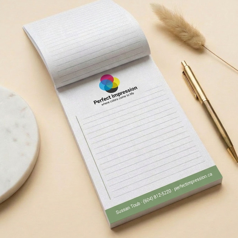 Linen notepad, flipped open beside a pen